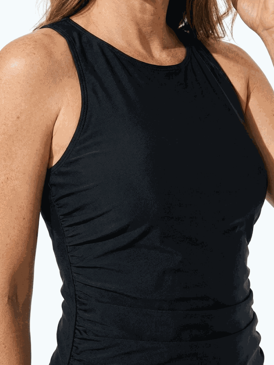 High-neck ruched tankini set with printed top and solid bottom, featuring gathered side seams and built-in shelf bra.