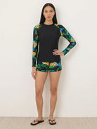 Long-sleeve swim rash guard top with matching mid-rise boyshort swim shorts in quick-dry stretch fabric