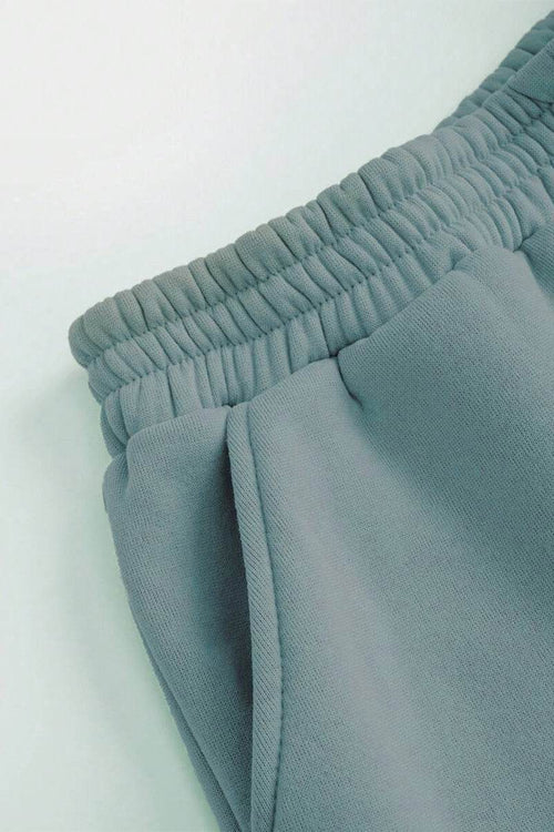 Close-up of soft cotton-blend joggers with elastic waistband from Classic Airplane Set in mint green