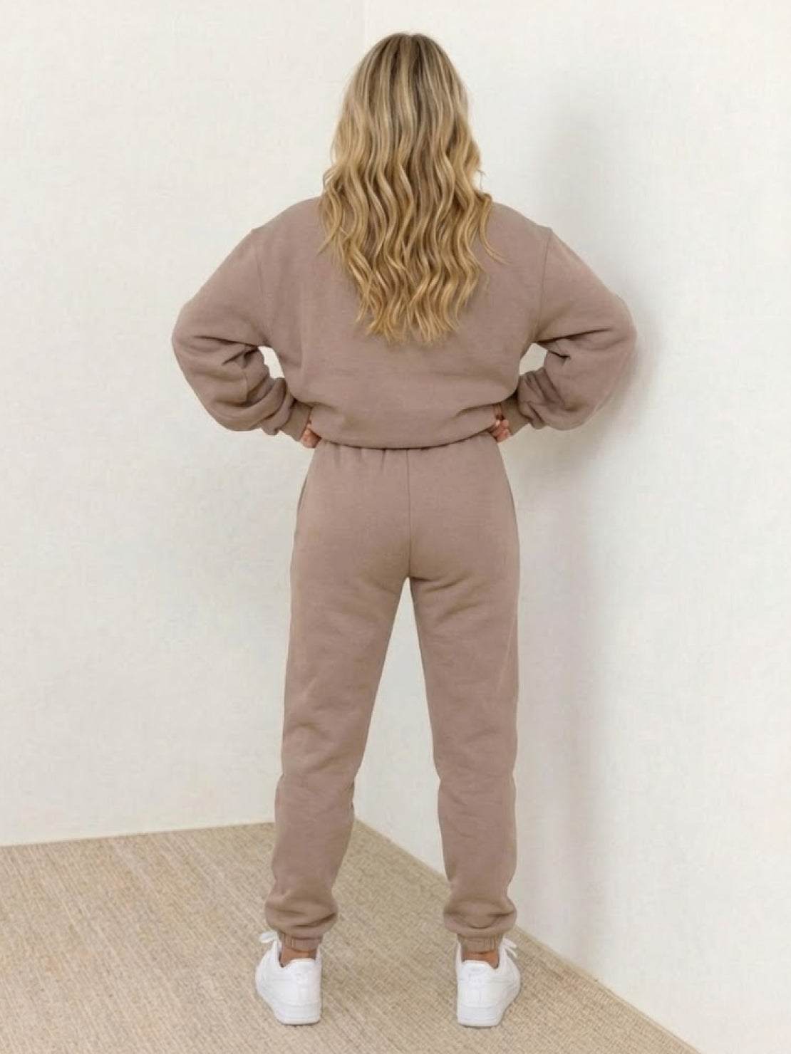 Woman wearing Classic Comfort Athleisure Set in casual pose on white background