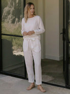 Minimalist cotton-linen monochrome outfit with relaxed longline top and wide-leg pants