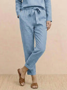 Cotton-linen monochrome capsule set featuring relaxed longline top and wide-leg pants in minimalist design