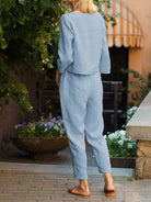 Woman wearing relaxed cotton-linen monochrome longline top and wide-leg pants set
