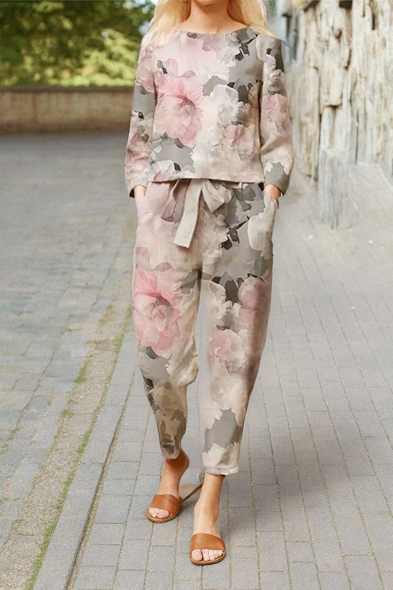 woman wearing cotton-linen monochrome floral print relaxed top and wide-leg pants set on outdoor pathway