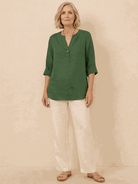 white pure linen age-defying shirt with button detail on hanger