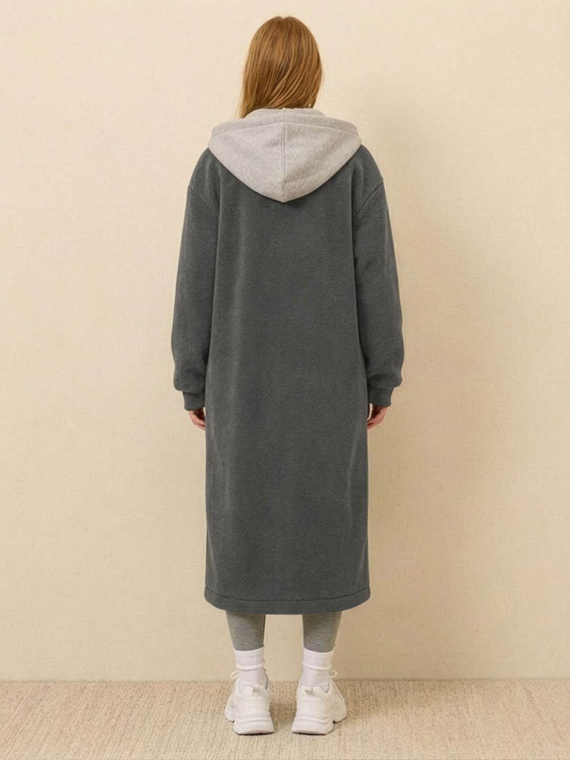 back view of cozy grey everyday wear oversized sherpa long coat with hood worn by woman