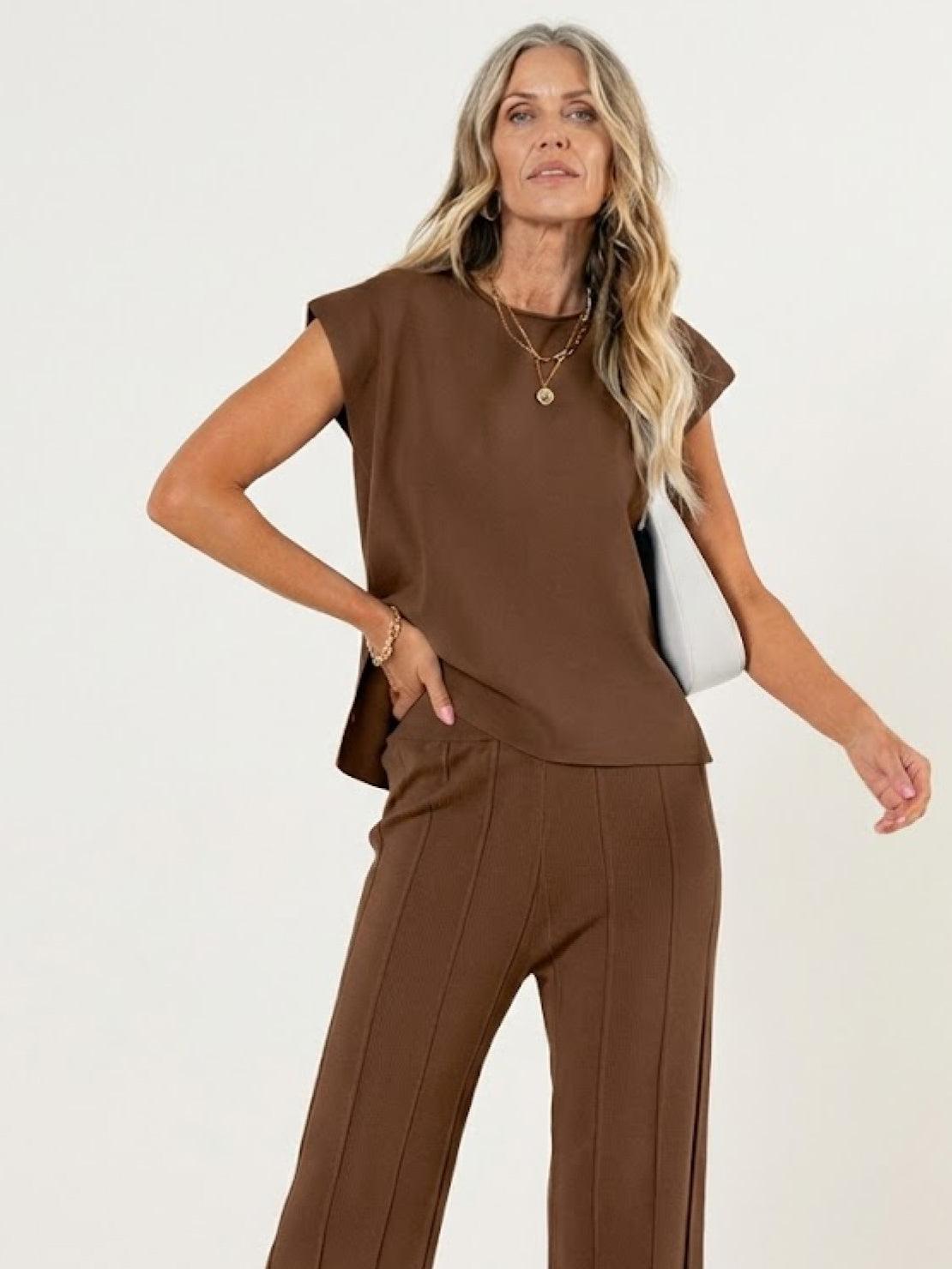 First Class Travel two-piece set in soft viscose-acrylic blend with pleated wide-leg pants and matching top, wrinkle-resistant and versatile for travel comfort.