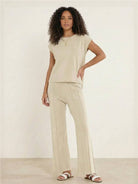 First Class Travel two-piece set in soft viscose-acrylic fabric with pleated wide-leg pants for comfortable elegance