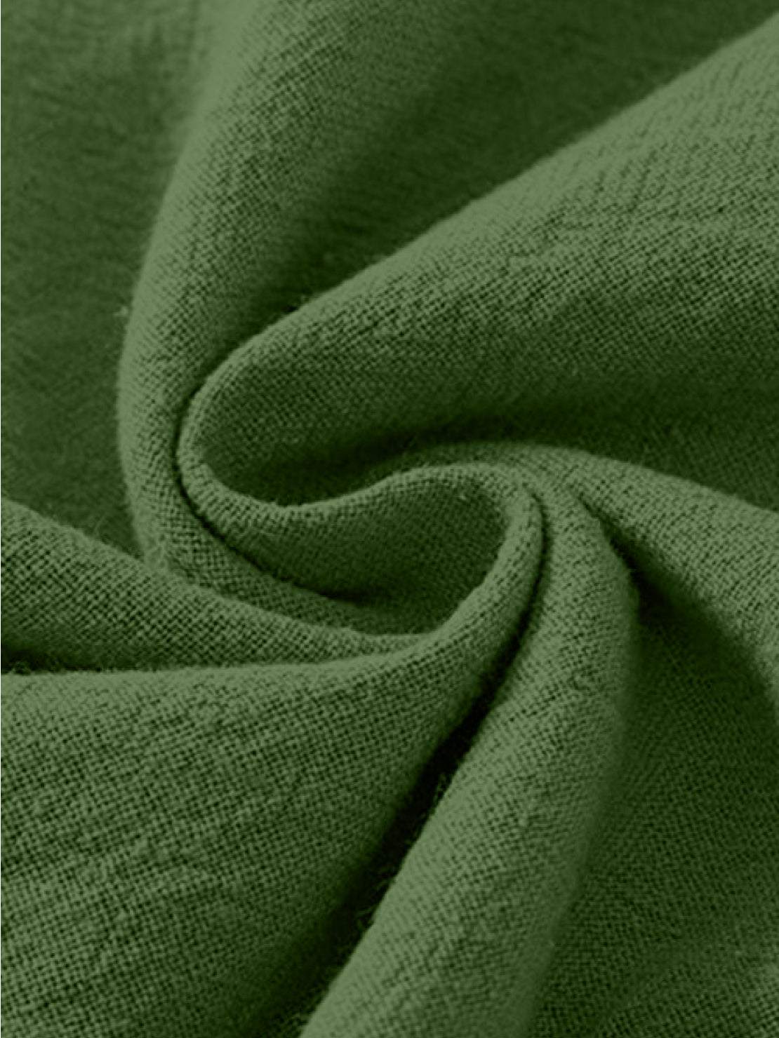 Close-up of green cotton linen fabric for high-waist palazzo pants made of breathable, lightweight material