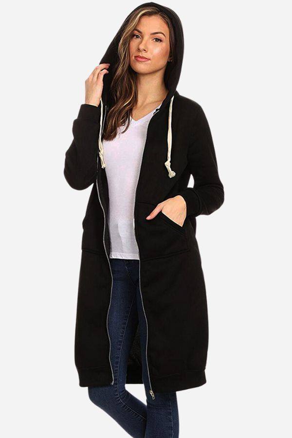 Oversized long zip sweatshirt hoodie in black with fleece lining and front pockets worn by woman