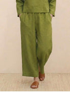 Loose solid color two-piece set with loose fit green linen-feel fabric pants and top for comfortable casual wear