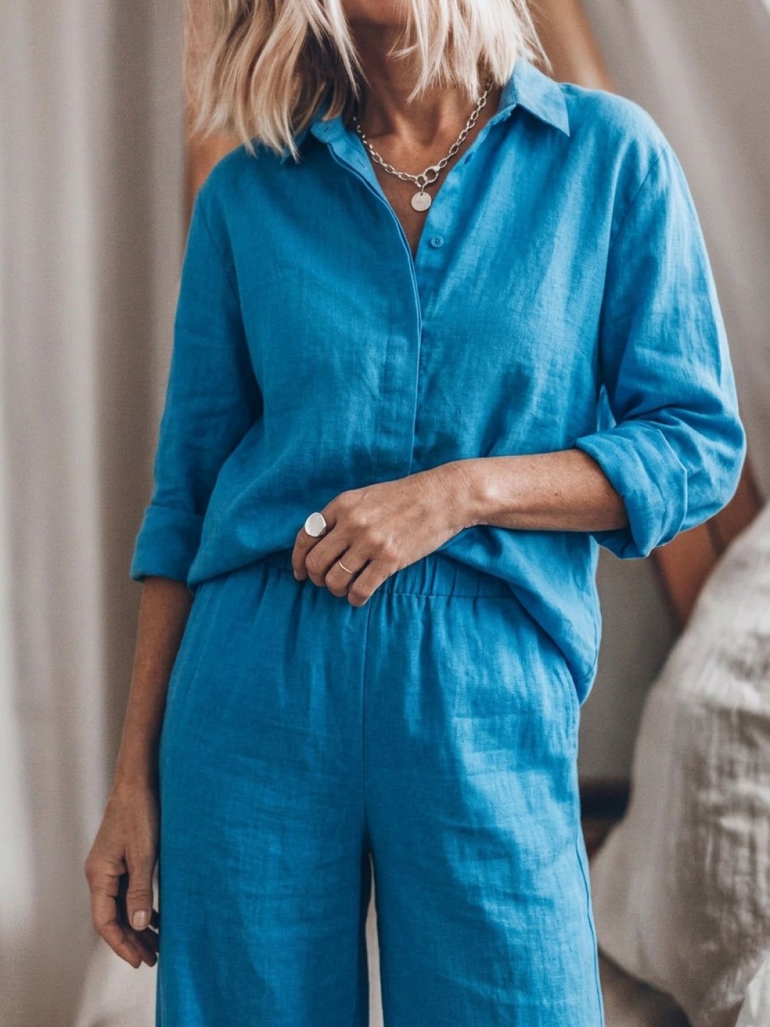 Model wearing an oversized 100% cotton shirt and wide-leg pants co-ord set in a relaxed, breathable fit