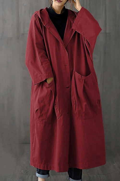Oversized water resistant windbreaker jacket with hood and large pockets in red, one size fits all.