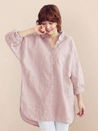 Oversized linen shirt in white made from 45% linen and 55% cotton with relaxed fit and back button detail
