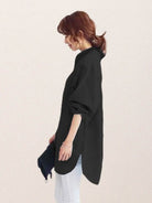 Oversized linen shirt with breathable cotton blend and relaxed, flowing silhouette