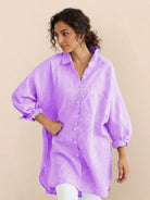 Oversized linen shirt with breathable cotton blend and relaxed fit displayed with size chart and model wearing white version