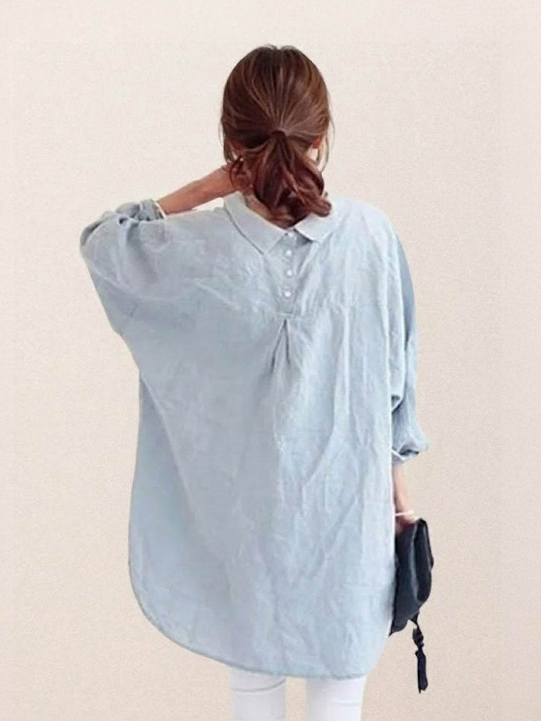 Oversized linen shirt in white with relaxed fit and back button detailing