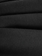 Close-up of soft black plush fabric texture for Plush & Preppy Camel Two-Piece Set