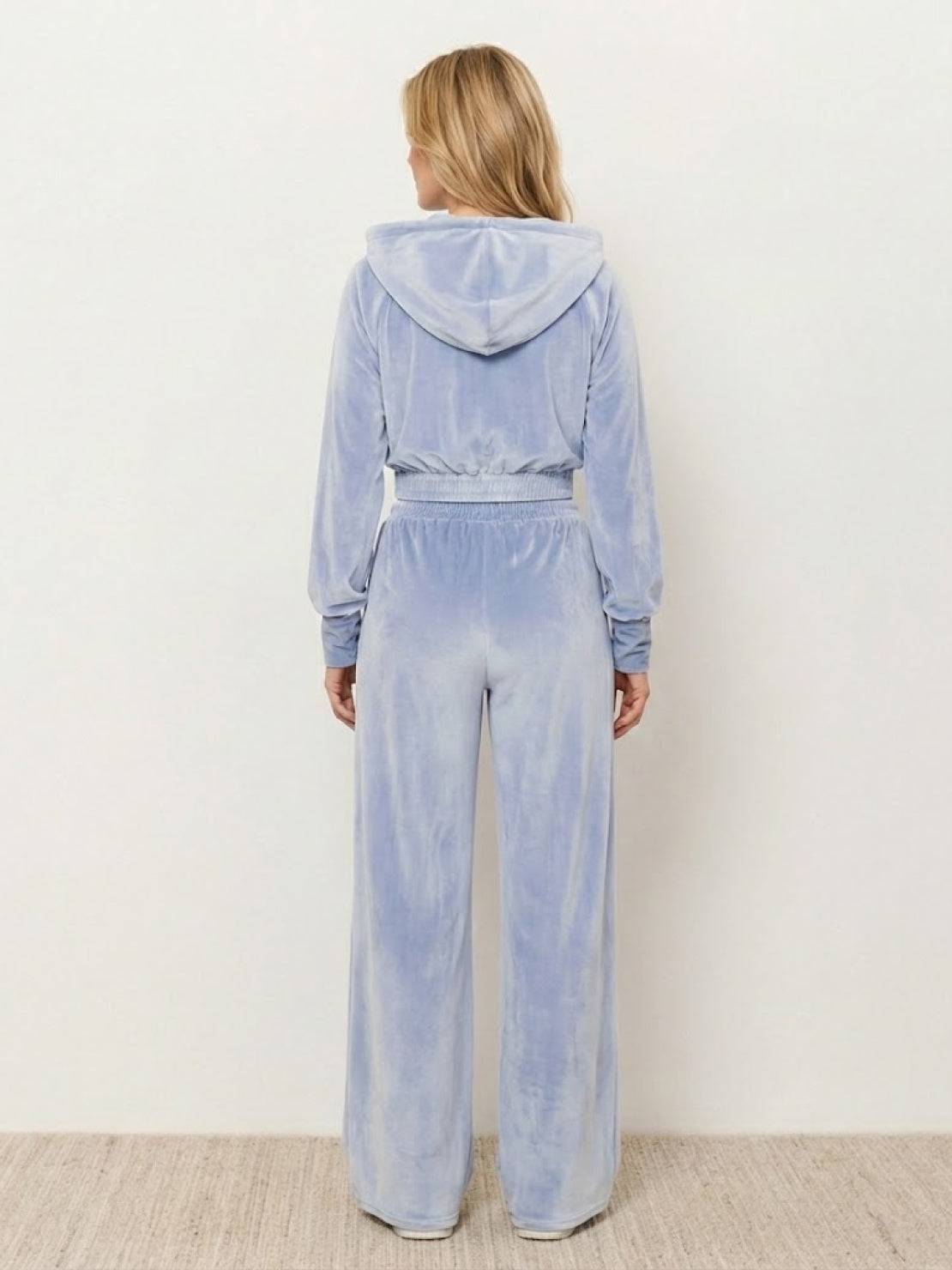 Modern cropped velour tracksuit set with high-waist pants in vibrant color and plush texture