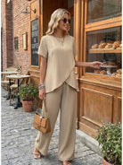 Women's Textured Elegance two-piece set with asymmetrical top and wide-leg pants in soft stretch fabric