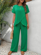 Textured Elegance two-piece set with asymmetrical top and wide-leg pants.