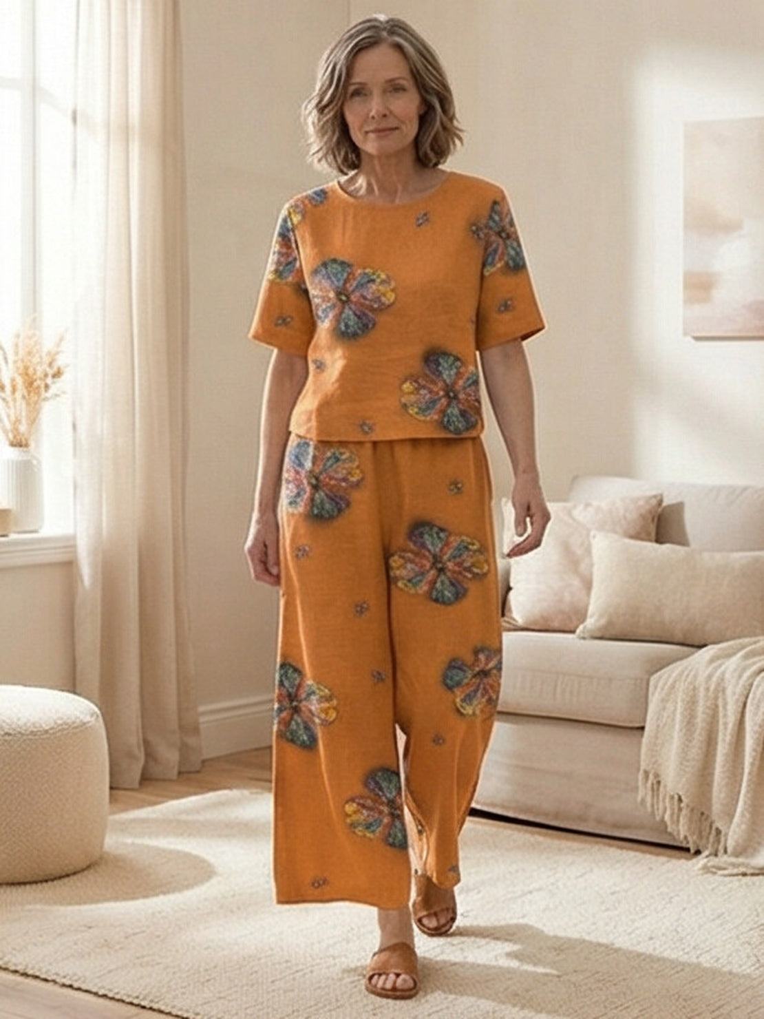 Loose fit co-ord set with soft-tailored top and wide-leg bottoms in breathable cotton blend.