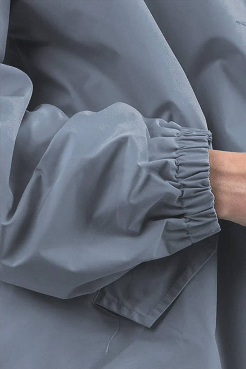 Close-up of Rain Couture Windbreaker sleeve in water-resistant grey fabric with elastic cuff detail