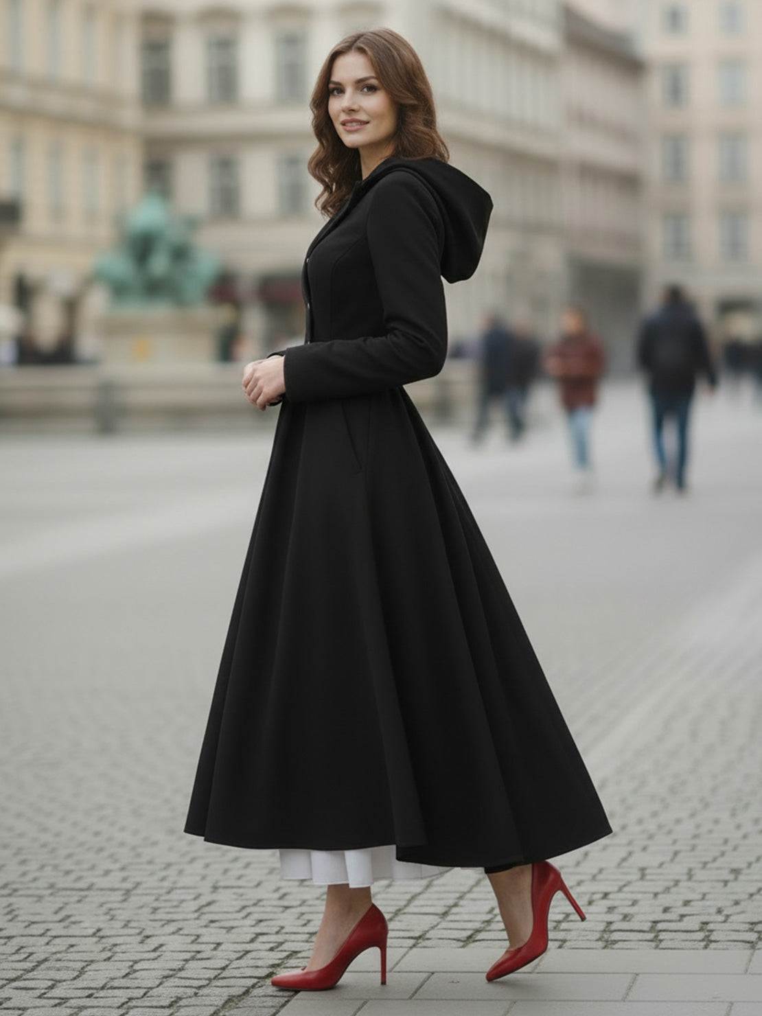 Woman wearing elegant water-repellent rain A-line hooded raincoat with belt outdoors