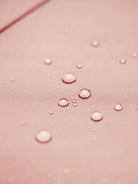 Water-repellent A-line hooded women's raincoat with matching belt and insulated lining