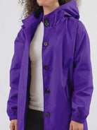 Water-resistant oversized hooded windbreaker rain jacket with multiple pockets and adjustable fit