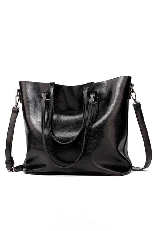 Black multi strap tote shopper bag in PU leather with multiple compartments and adjustable shoulder and crossbody straps